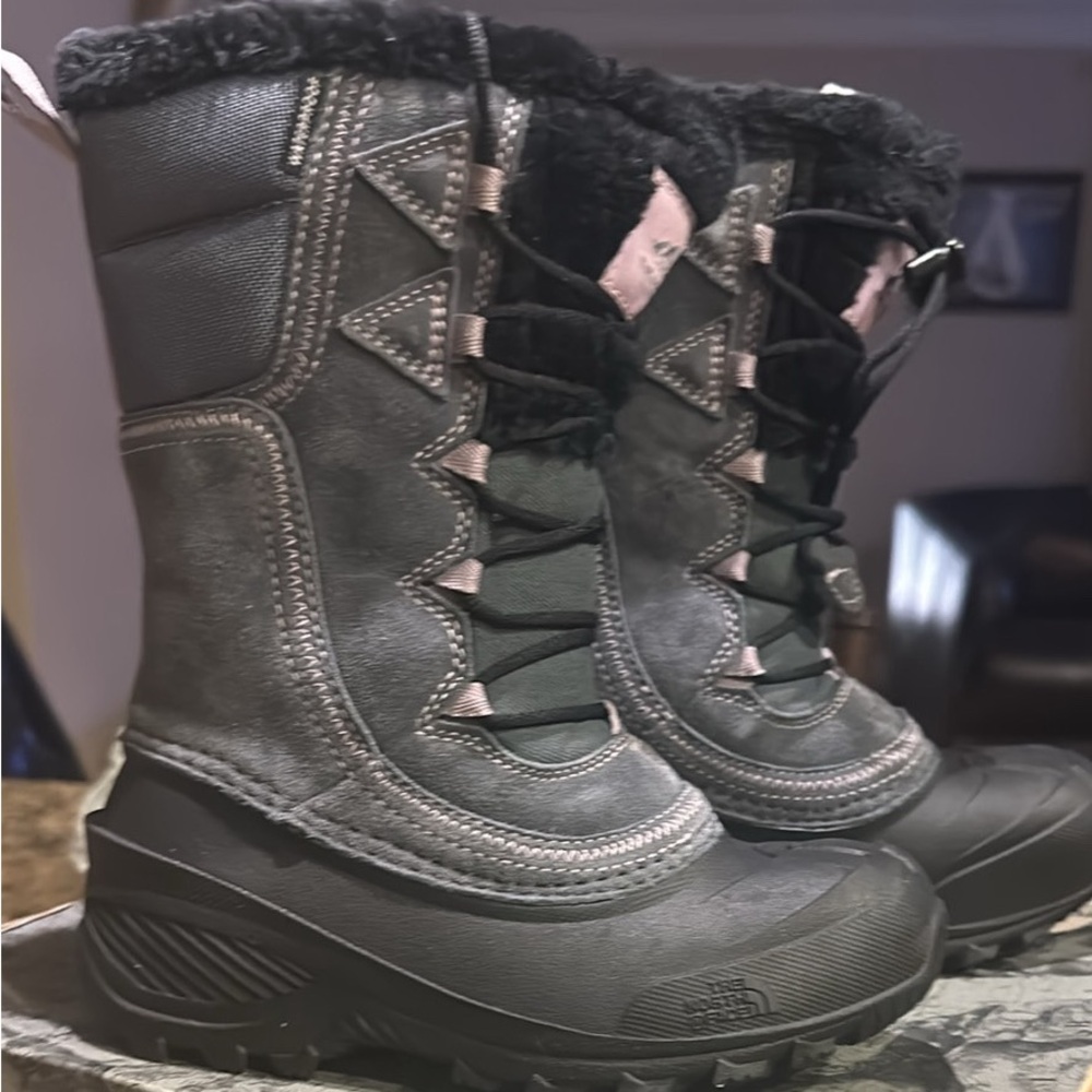 Brand new The North Face kids winter boots .